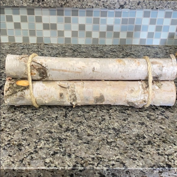 Three white birch logs